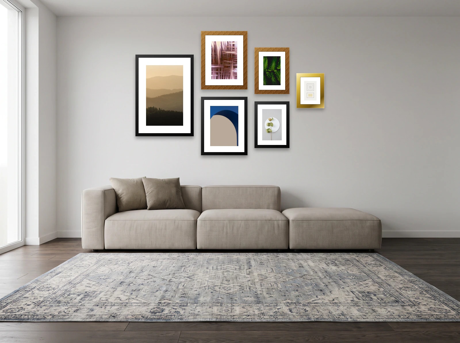 Gallery wall template above a sectional sofa: six frames of four sizes in an asymmetric cluster on a soft white wall