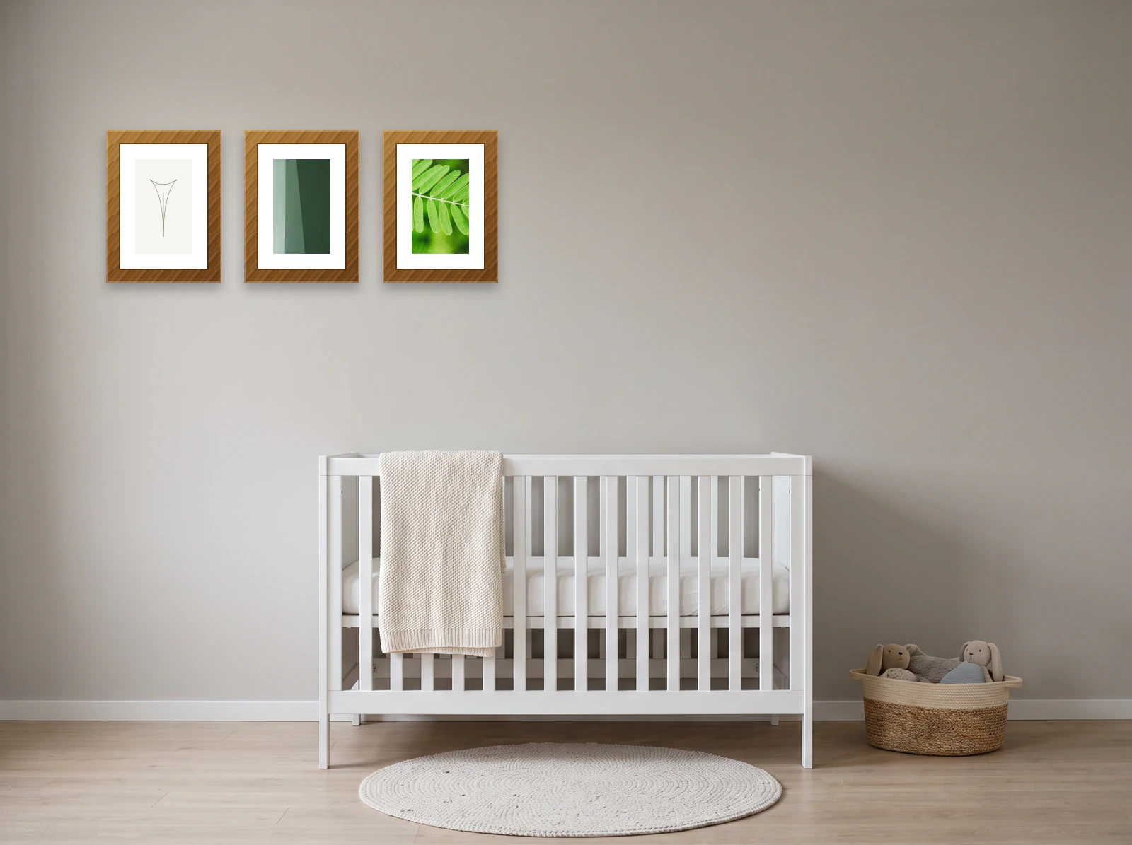 Nursery gallery wall template: three 24 × 30 cm frames in a row beside a white cot on a greige wall