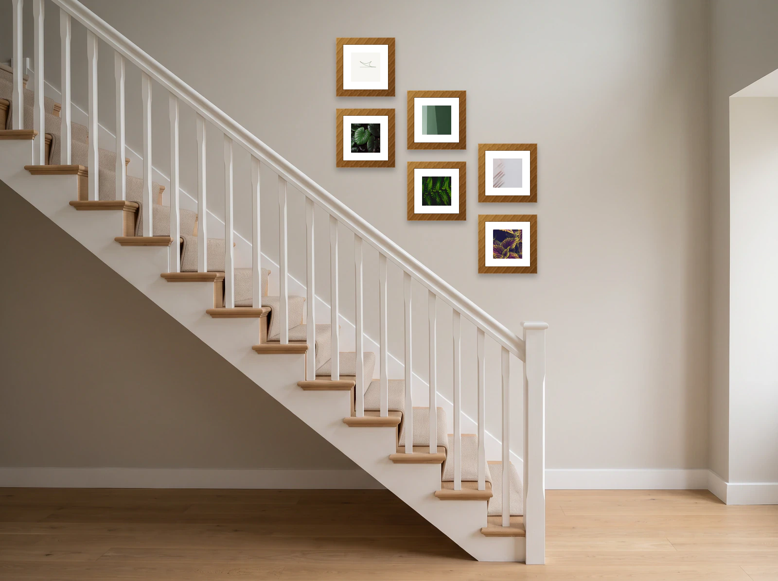 Stairway gallery wall template: six 30 × 30 cm wood frames in stepped pairs above a white banister on a warm grey wall