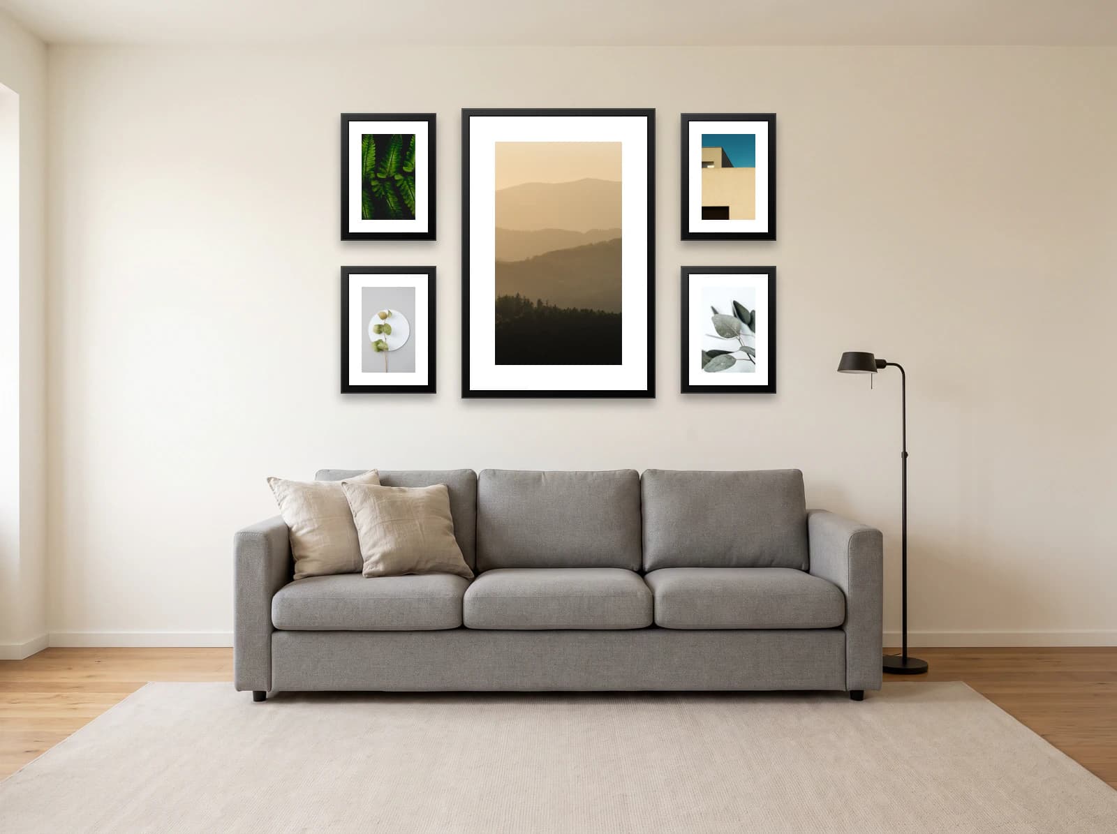 Gallery wall template above a grey sofa: one 61 × 91 cm frame between four 30 × 40 cm frames on a warm white wall